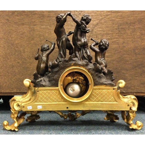 640 - A good French bronze mantle clock heavily decorated with scrolls with gilt dial. Est. £150 - £200.