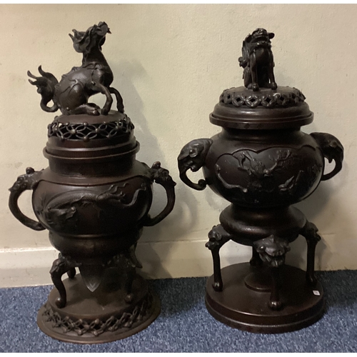 641 - A good matched pair of bronze censers on stands with lift off covers decorated with animals. Est. £4... 