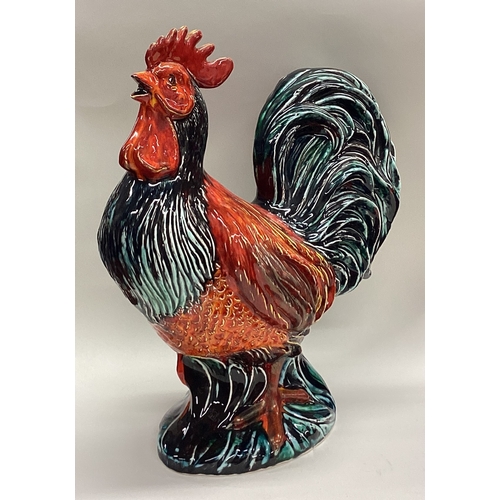 643 - ANITA HARRIS: A large pottery figure of a cockerel. Signed to base. Est. £80 - £120.