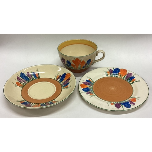 647 - CLARICE CLIFF: An old pottery trio of typical form. Est. £20 - £30.