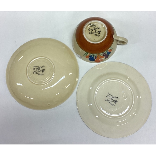 647 - CLARICE CLIFF: An old pottery trio of typical form. Est. £20 - £30.