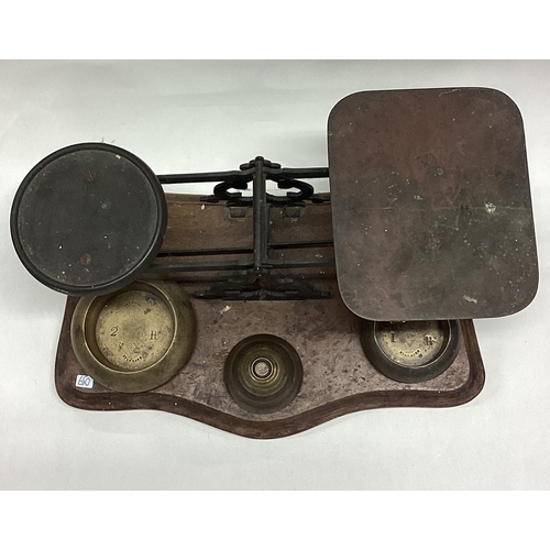 650 - A large pair of chemist scales and weights. Est. £20 - £30.