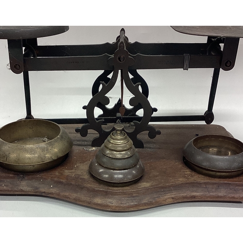 650 - A large pair of chemist scales and weights. Est. £20 - £30.