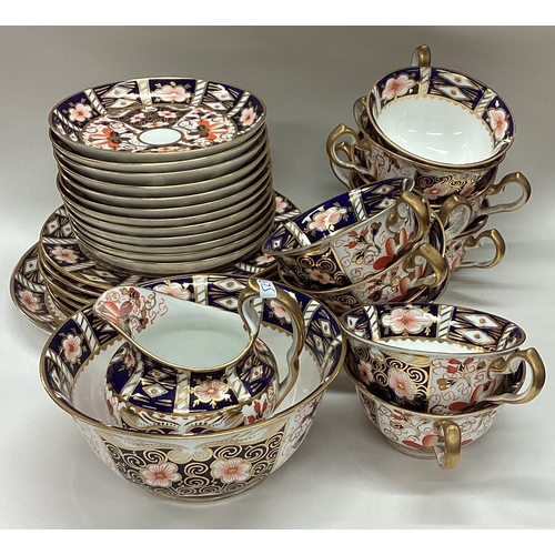 675 - A large Royal Crown Derby tea service. Numbered 2451. Est. £80 - £120.