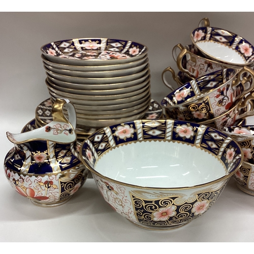 675 - A large Royal Crown Derby tea service. Numbered 2451. Est. £80 - £120.