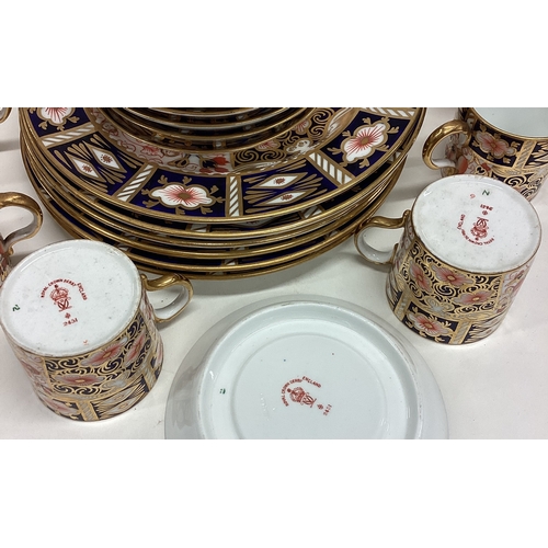 676 - A good six piece Royal Crown Derby coffee set. Numbered 2451. Est. £80 - £120.