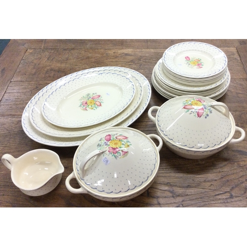 677 - A large Susie Cooper dinner service. Est. £30 - £50.