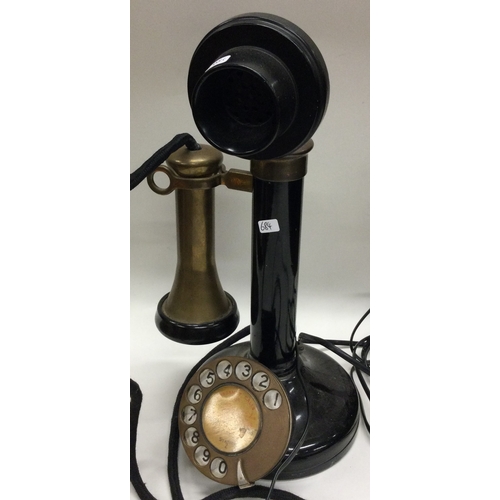 684 - An unusual brass mounted telephone. Est. £20 - £30.