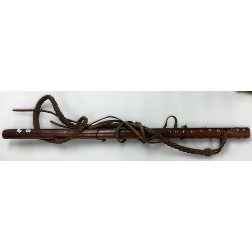 688 - An unusual Tibetan whip. Est. £50 - £80.