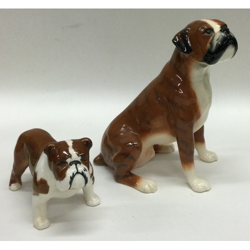 691 - Two boxed Beswick Boxer dog figures. Est. £20 - £30.