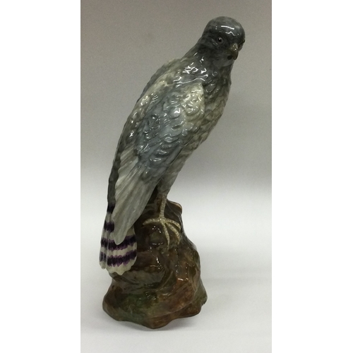 697 - An attractive Staffordshire figure of a falcon. Designed by J.T Jones. Est. £50 - £80.