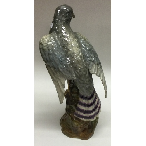 697 - An attractive Staffordshire figure of a falcon. Designed by J.T Jones. Est. £50 - £80.