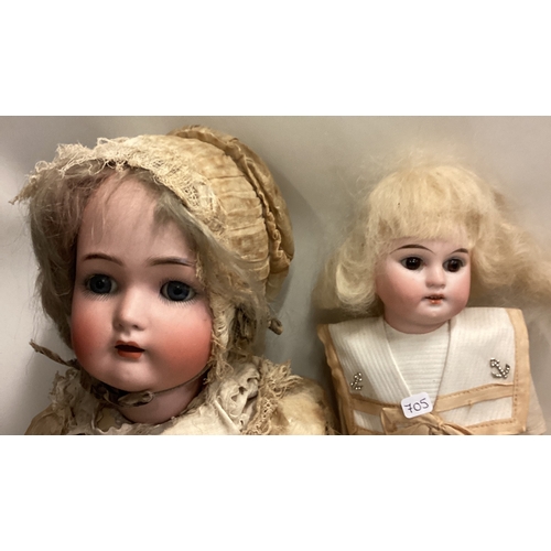 705 - Two German porcelain headed dolls. Est. £40 - £60.