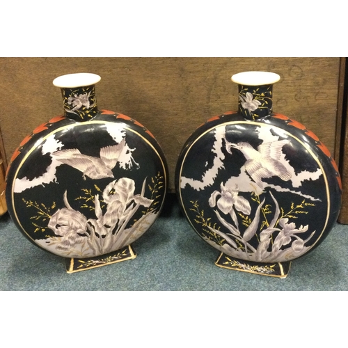 712 - A pair of large Chinese vases decorated with birds on dark background. Est. £80 - £120.