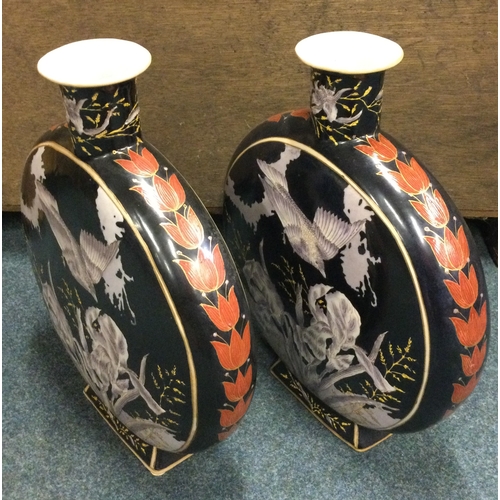 712 - A pair of large Chinese vases decorated with birds on dark background. Est. £80 - £120.