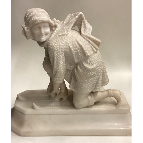 714 - A good carved marble figure of a lady with skis with textured body. Approx. 29 cms x 32 cms. Est. £4... 