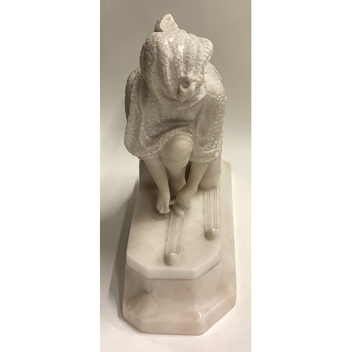 714 - A good carved marble figure of a lady with skis with textured body. Approx. 29 cms x 32 cms. Est. £4... 