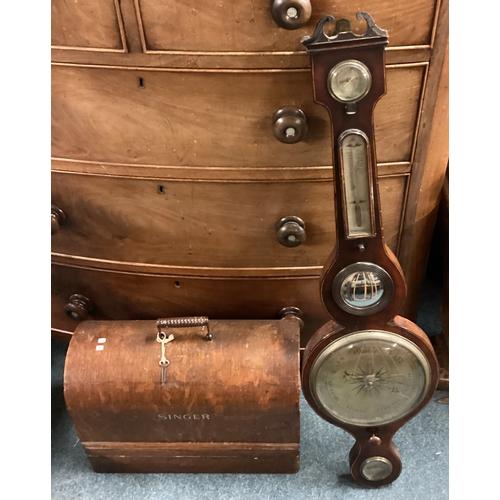 716 - A banjo barometer together with a sewing machine. Est. £20 - £30.