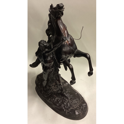 719 - A good pair of large bronze figures of horses on rugged landscape. Signed to base. Est. £100 - £200.