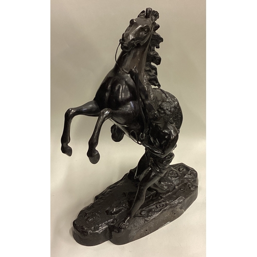 719 - A good pair of large bronze figures of horses on rugged landscape. Signed to base. Est. £100 - £200.