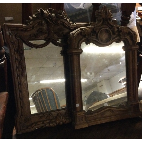 725 - Two carved oak small mirrors. Est. £20 - £30.