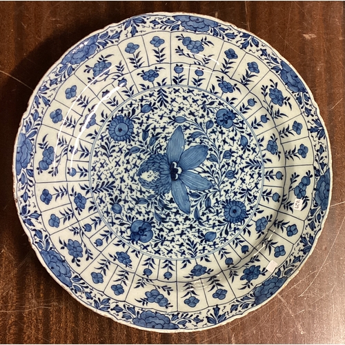 729 - A large circular Chinese blue and white wall charger with floral decoration. Est. £30 - £50.