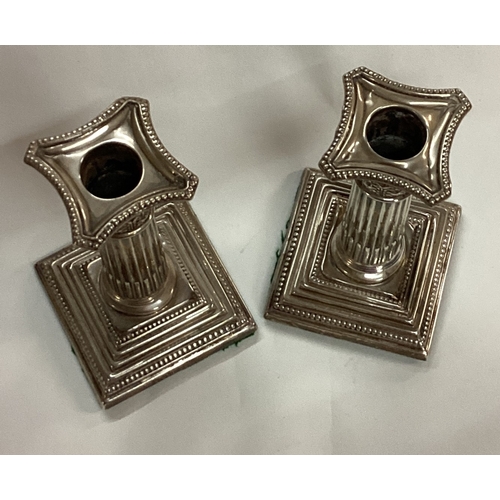 73 - A pair of silver Corinthian candlesticks. Birmingham 1913. Approx. 415 grams of gross weight. Est. £... 