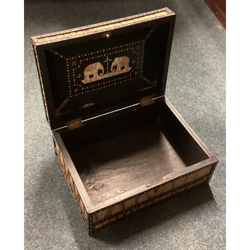 731 - An unusual cane hinged top box. Est. £20 - £30.