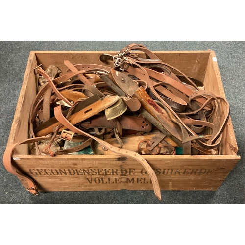 740 - A large box containing vintage ice skates. Est. £20 - £30.