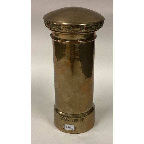 744 - A small brass money box in the form of a post box. Est. £40 - £60.