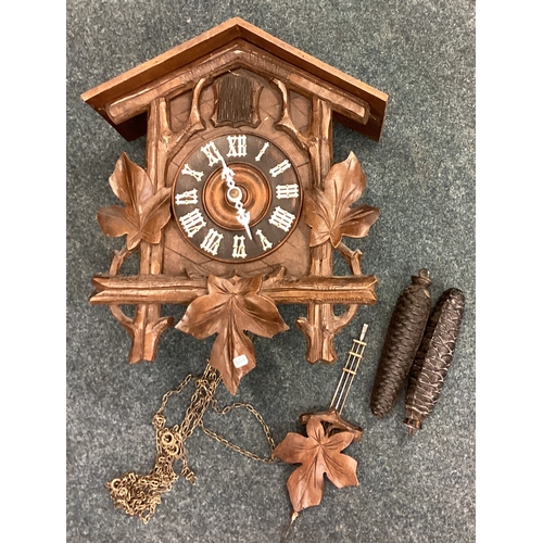 759 - An old carved cuckoo clock. Est. £30 - £50.