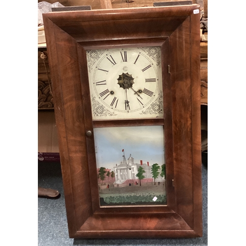 760 - An old mahogany mounted wall clock. Est. £40 - £60.