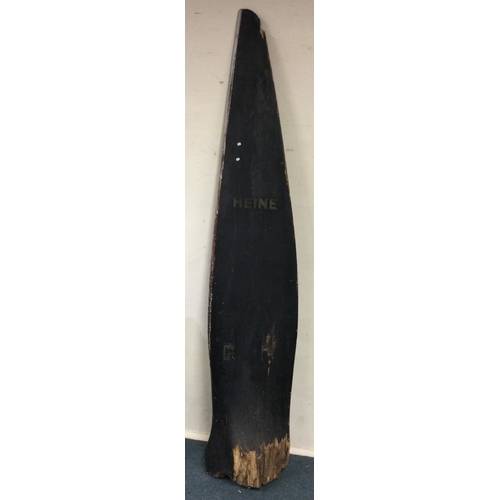 765 - A large wooden propeller marked 