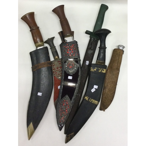 788 - A good collection of Gurkha knives together with a bayonet. Est. £30 - £50.