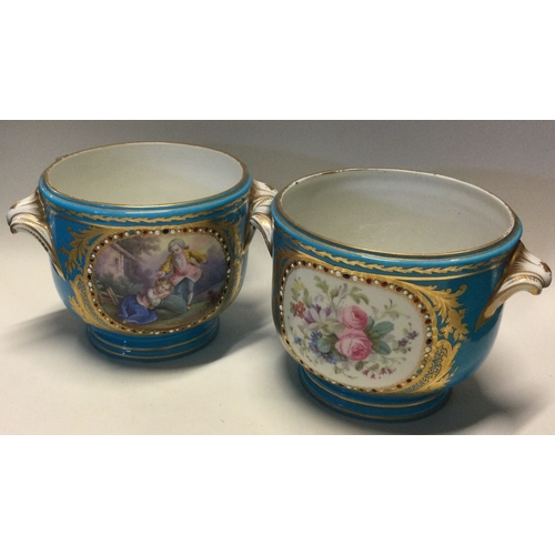 791 - An attractive pair of Continental jardinières decorated with figures. Est. £30 - £50.