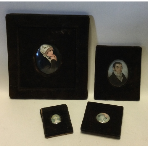 800 - A large oval porcelain miniature of a lady together with three others. Est. £30 - £50.