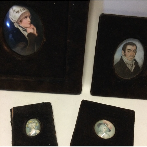 800 - A large oval porcelain miniature of a lady together with three others. Est. £30 - £50.