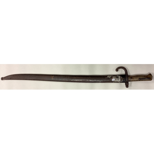 801 - A brass mounted bayonet with sheath. Est. £30 - £40.