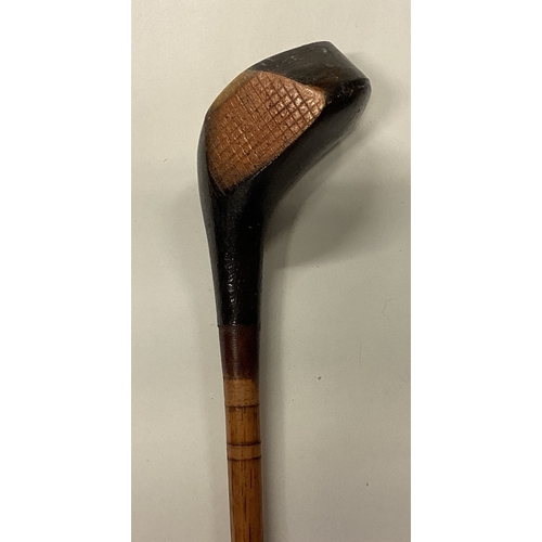 806 - An old tapering wooden golf club. Est. £20 - £30.