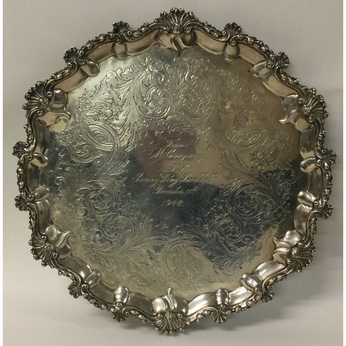 80C - An attractive circular Victorian silver salver with scroll decoration. London. By WS. Approx. 607 gr... 