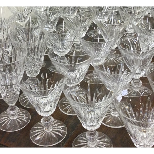 855 - WATERFORD: A good extensive suite of glass drinking vessels of tapering form. Est. £300 - £500.