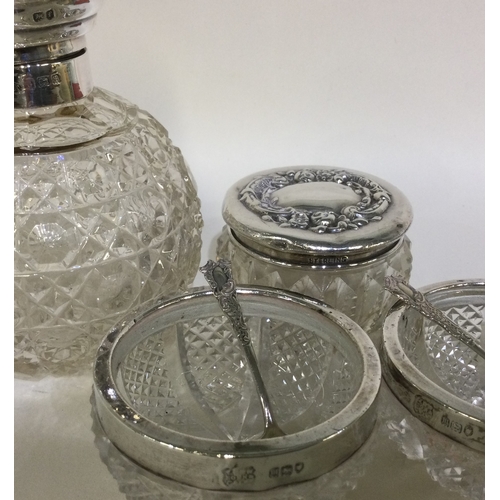 86 - A silver hobnail cut scent bottle together with a pair of silver mounted salts. Est. £20 - £30.