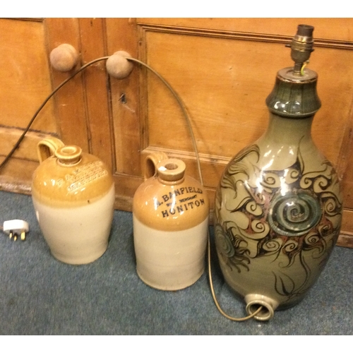 867 - A Honiton stoneware bottle together with one other and a lamp. Est. £20 - £30.