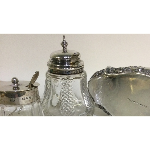 89 - Two silver and glass mounted bottles of shaped form together with an oval trinket box. Est. £30 - £4... 