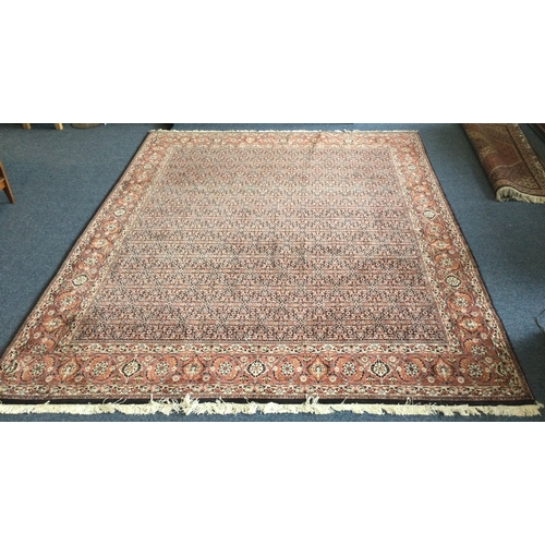 901 - A good large patterned carpet decorated in bright colours. Approx. 353 cms x 258 cms. Est. £100 - £1... 