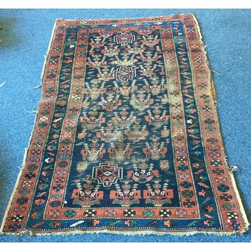 905 - An old tapestry rug. Approx. 112 cms x 200 cms.  Est. £30 - £50.