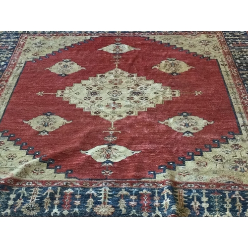 917 - A large Antique rug decorated in bright colours with central medallion. Approx. 231 cms x 284 cms. E... 