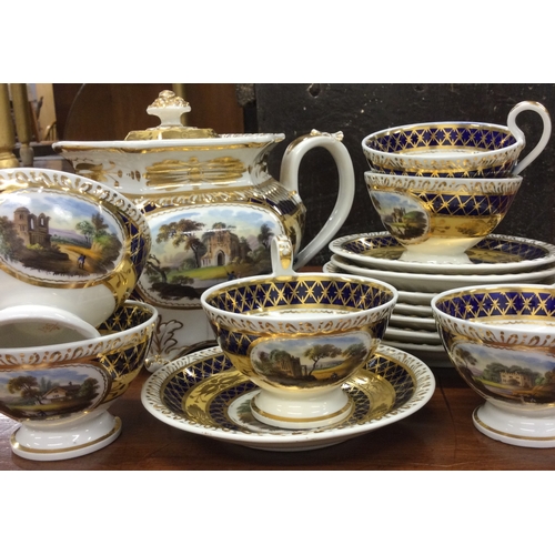 922 - A Ridgway part tea service decorated with landscapes. Pattern number 21387. Est. £20 - £30.