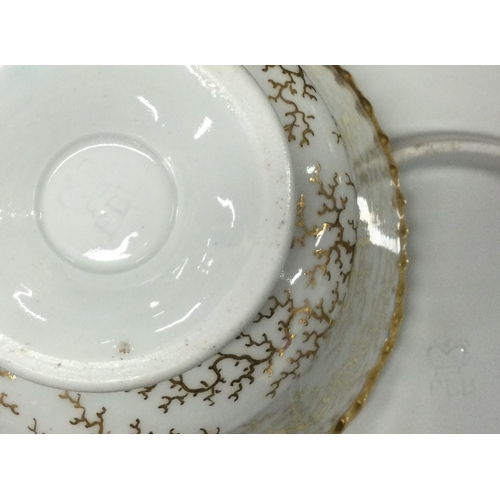 926 - A Flight, Barr & Barr Worcester part tea service with gilt seaweed pattern. Est. £20 - £30.