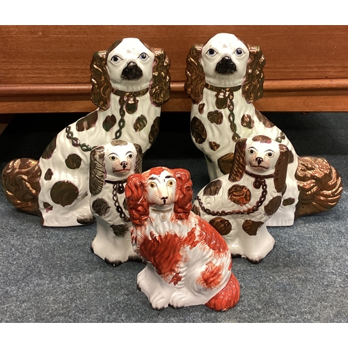 938 - A group of five Staffordshire dogs. Est. £40 - £60.